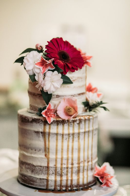 Wedding cake with flowers and caramel drip